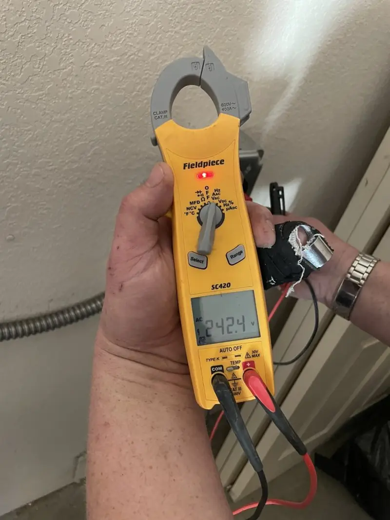 Voltage testing with clamp meter during Circuit Breaker Repair in Scott City